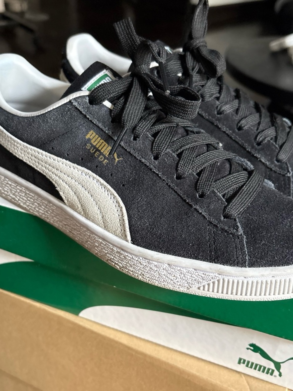 Puma Suede Low-Top Sneakers in Black and White